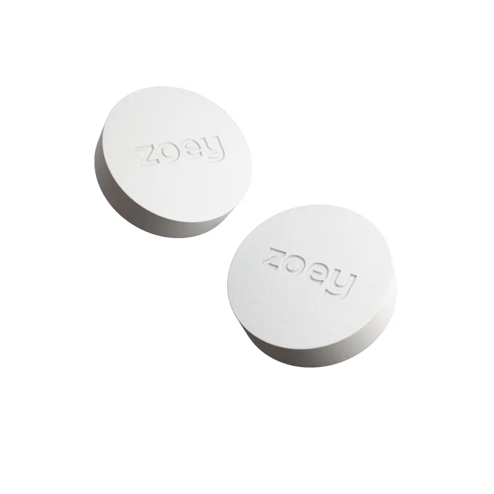 Two white tablets embossed with the zoey wordmark